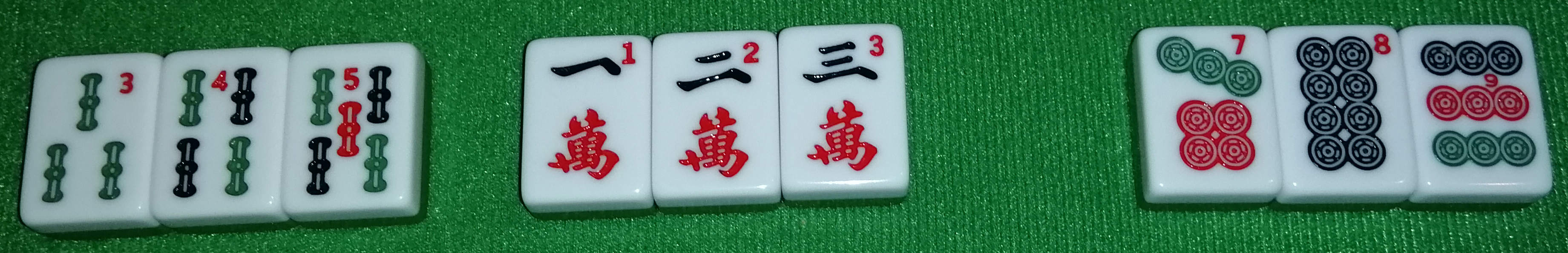 Three different straight melds, from left to right: A 3-4-5 Sou, a 1-2-3 Wan, and a 7-8-9 Pin.